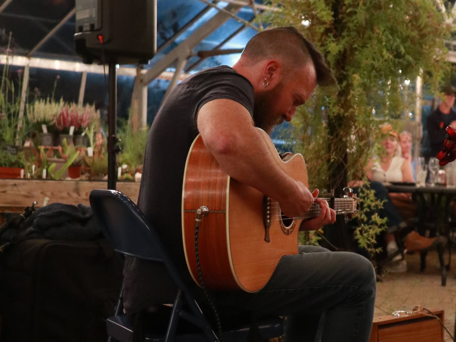 Jim from Ceol Na Mara playing the guitar at the folk night at Babylon.