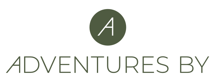 Adventures By logo