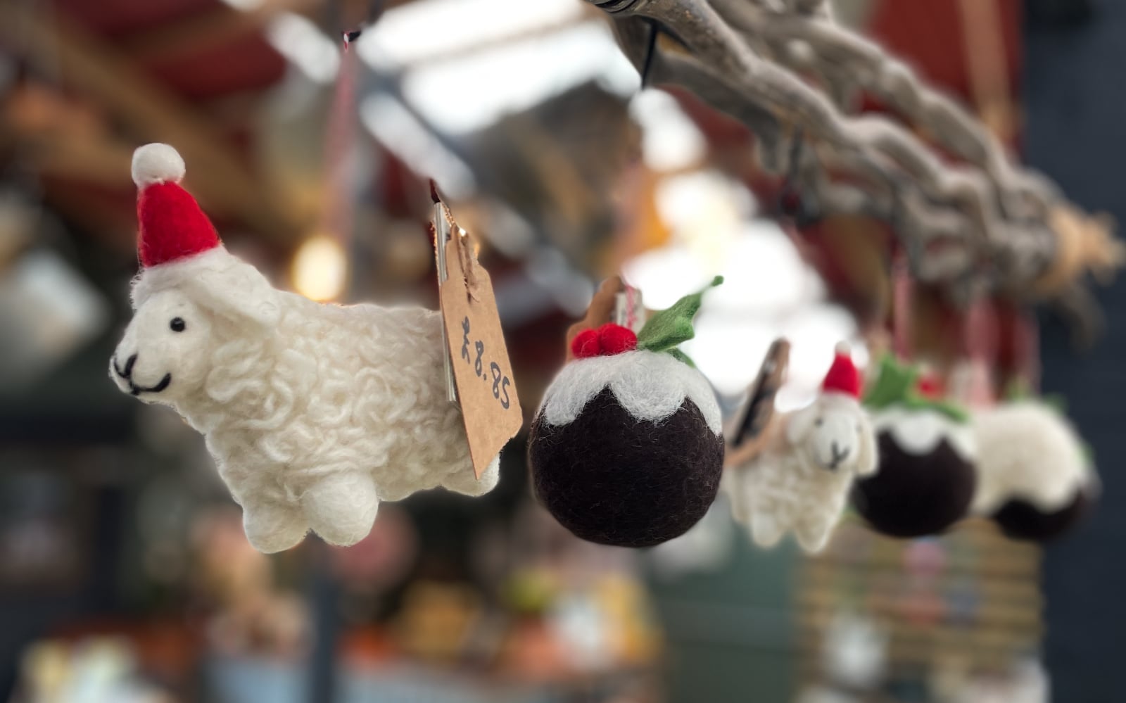 Handmade Christmas decorations hanging in The Shop.
