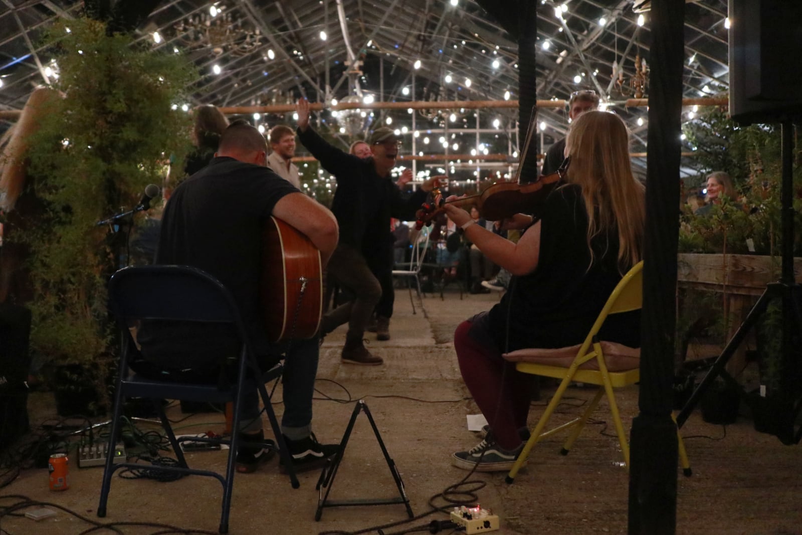 The view of Ceol na Mara playing from behind with people dancing in the background.