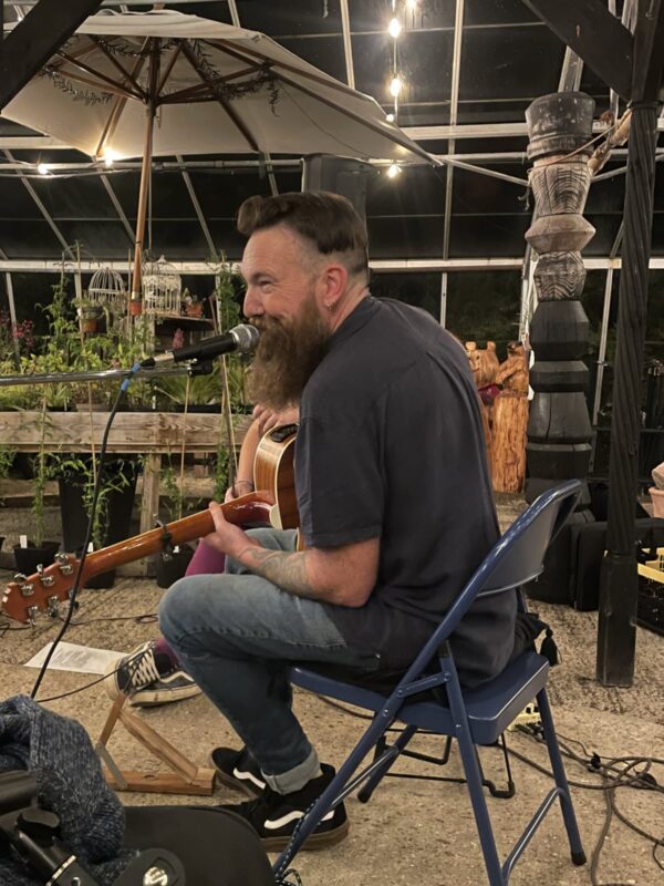 Tom Cole playing in the greenhouse at Babylon