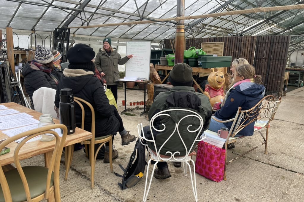 Rachael taking a class in the greenhouse.