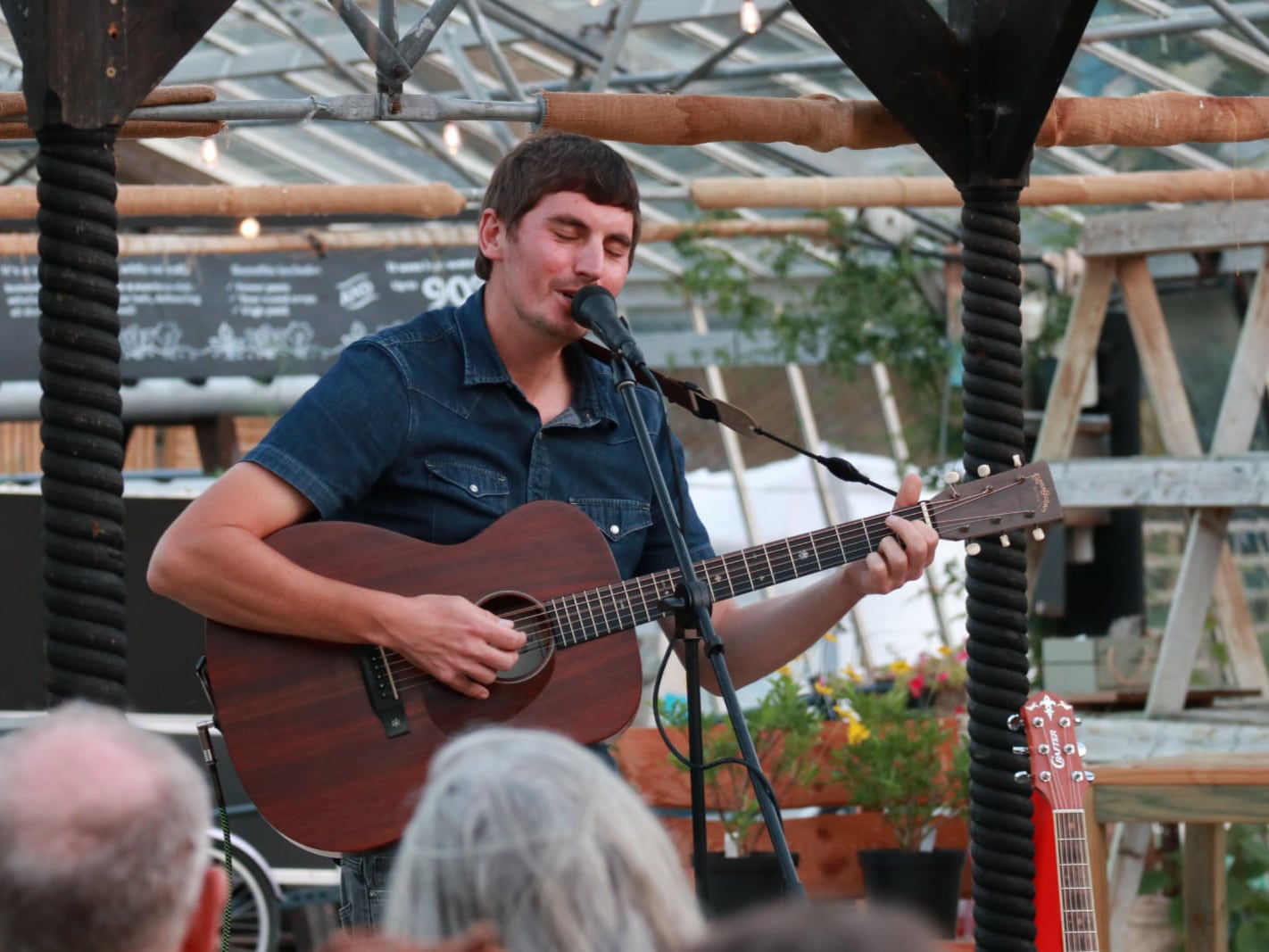 Tom Cole playing in the greenhouse at Babylon