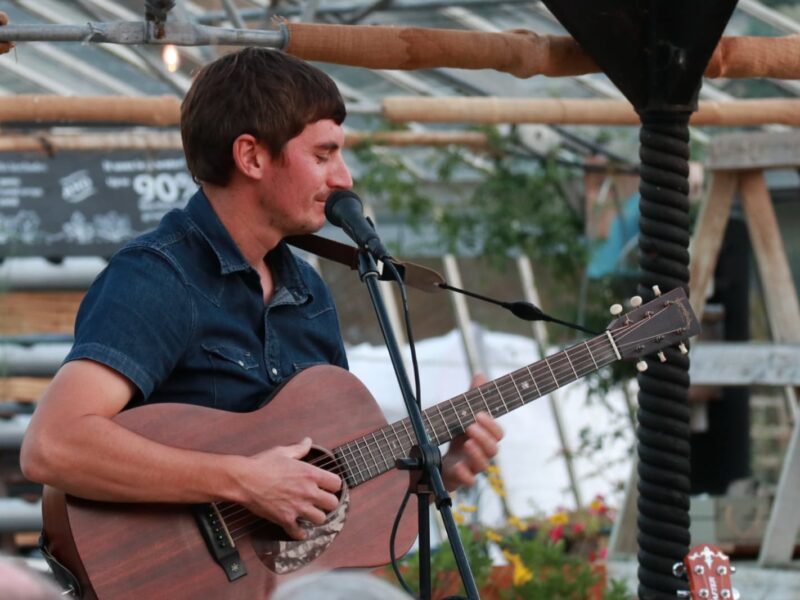 Tom Cole playing in the greenhouse at Babylon