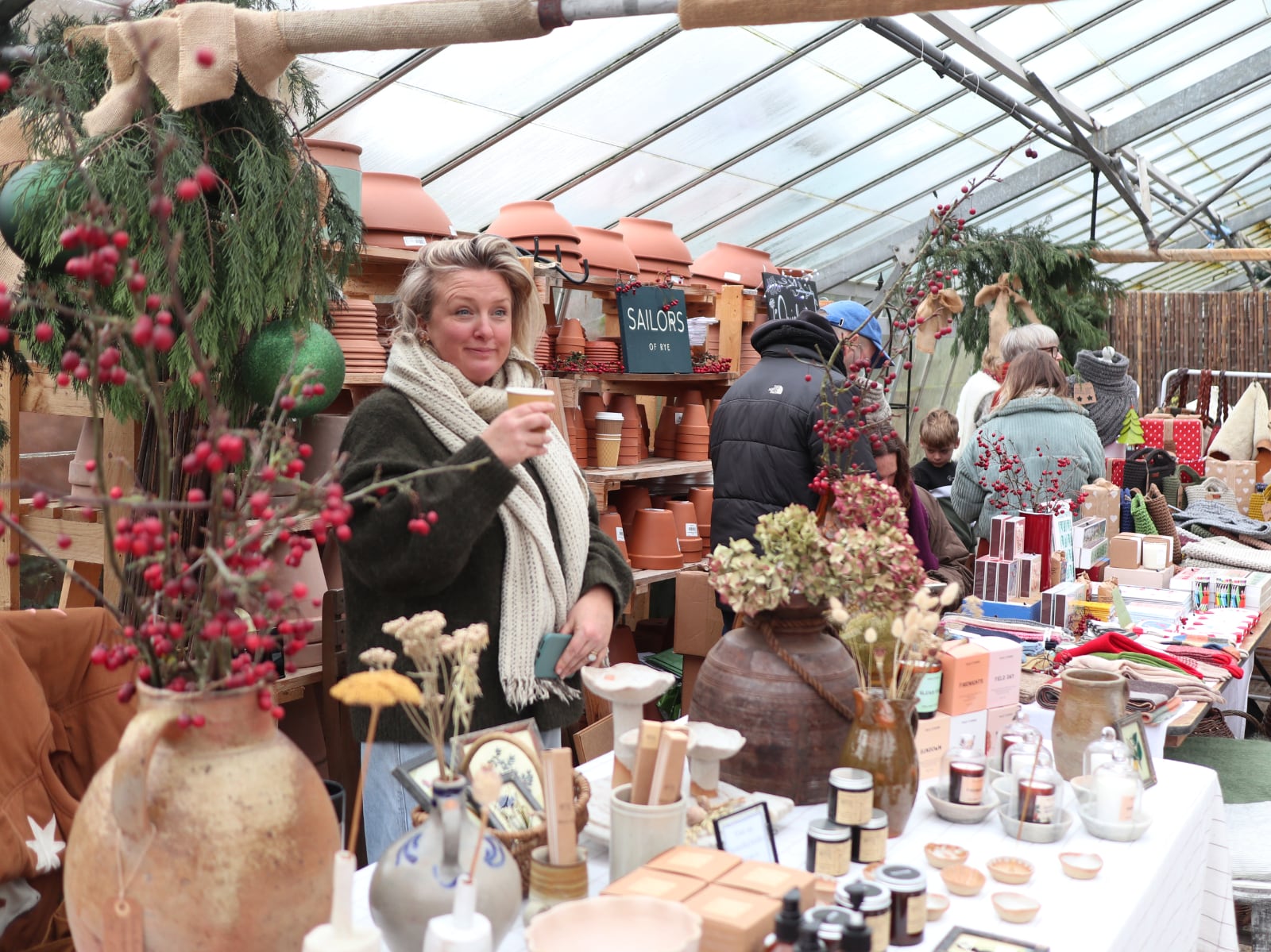 Nicky Guymer from Heath + Down in the greenhouse drinking mulled wine (as usual!)