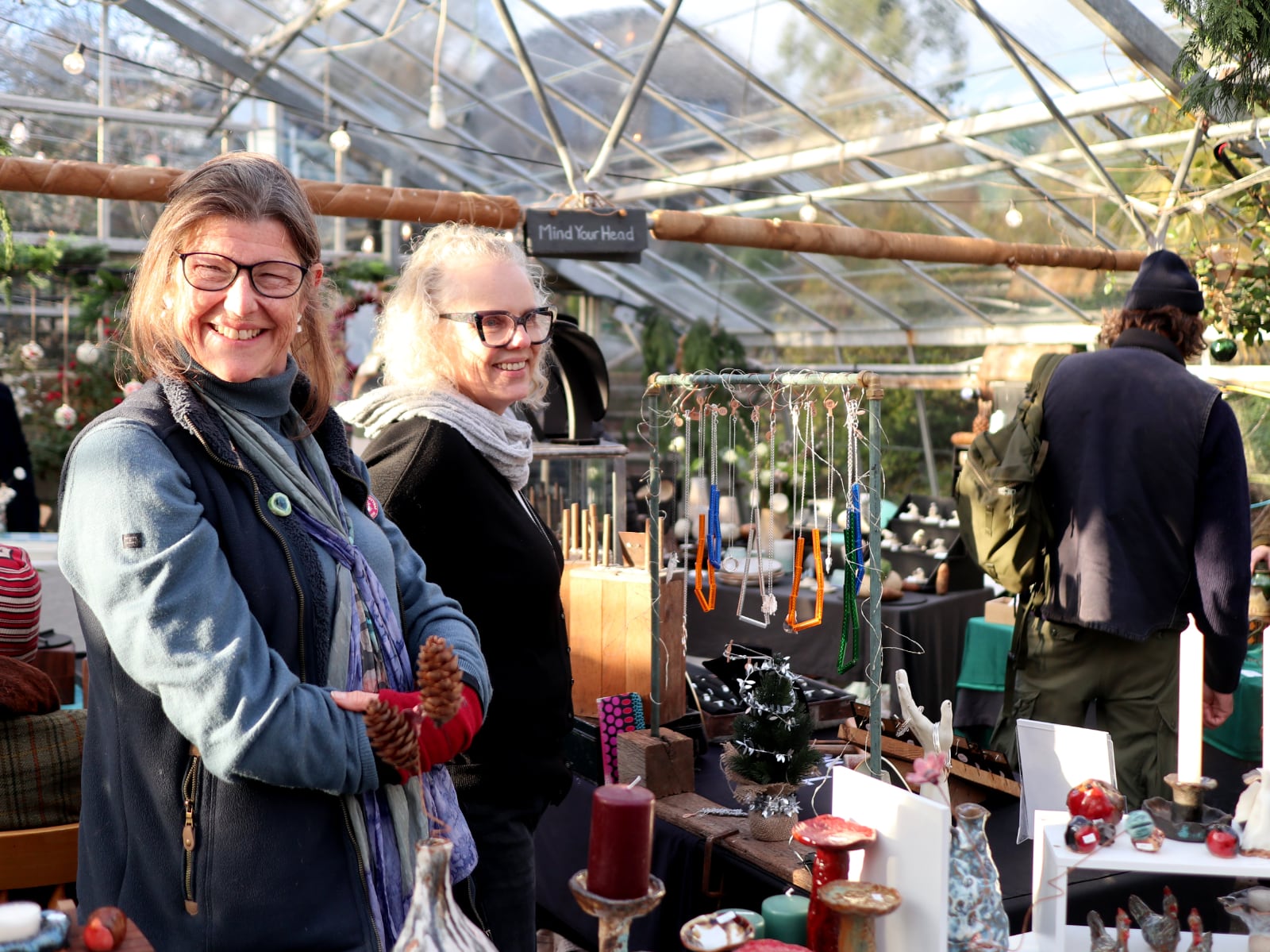 Two of the stallholders at our Christmas Market, smiling at the camera.