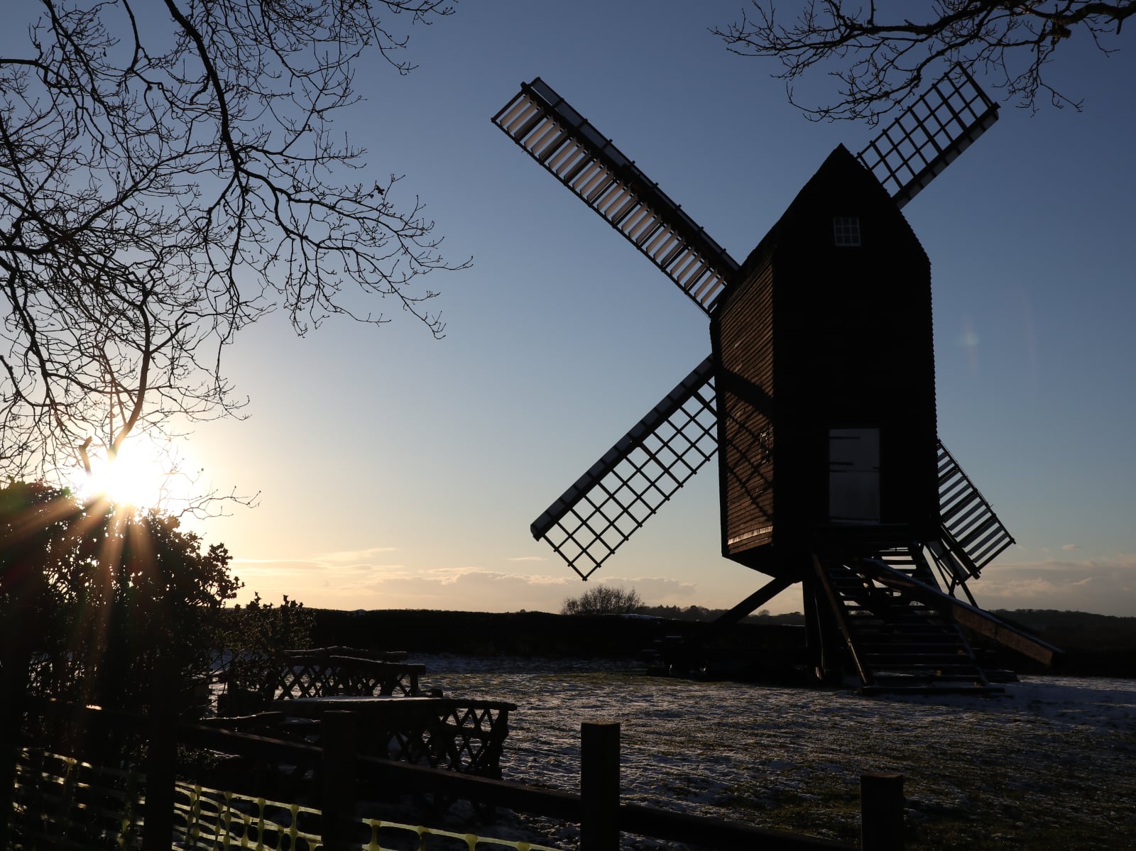 Nutley Windmill in silhouette with the sun setting behind