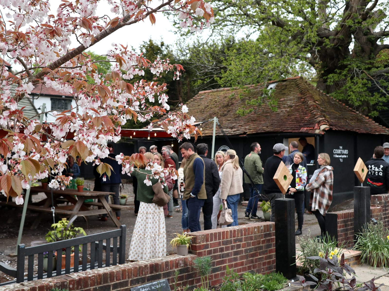 The Courtyard at Babylon with people milling about during a launch party.