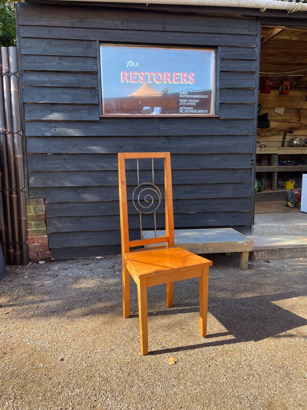 Wooden chair with metal back, repaired by The Restorers.