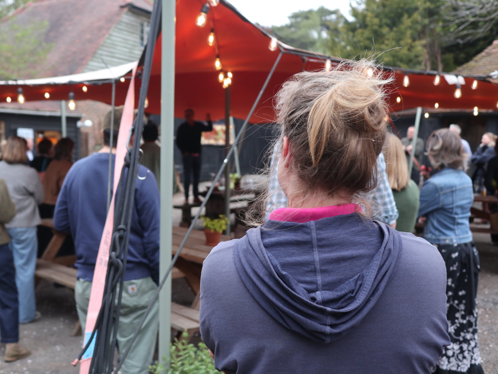 Lots of people watching gathered in the courtyard at Babylon