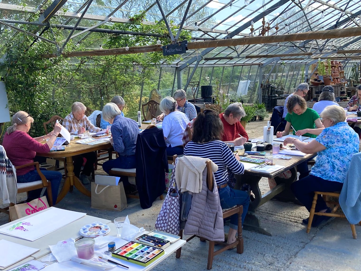 Jan Moffitt art class in the greenhouse at Babylon