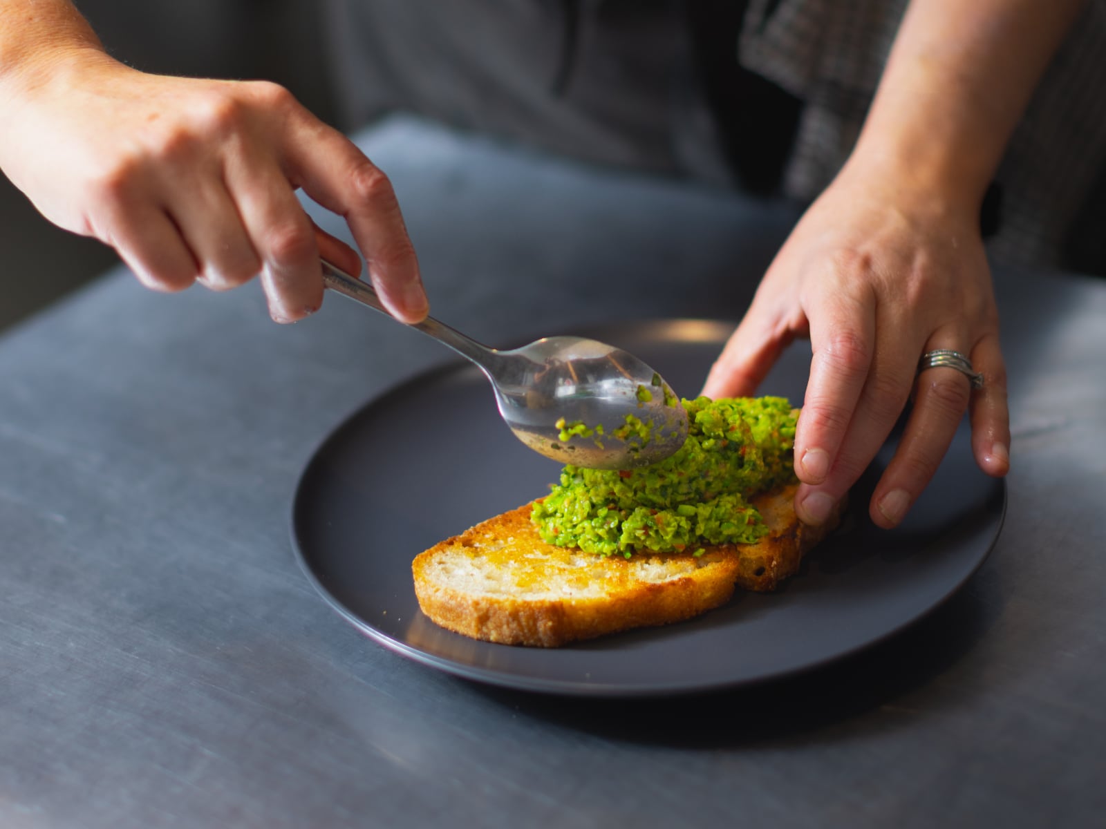 Plating up our pea and broadbean guacamole in the restaurant.